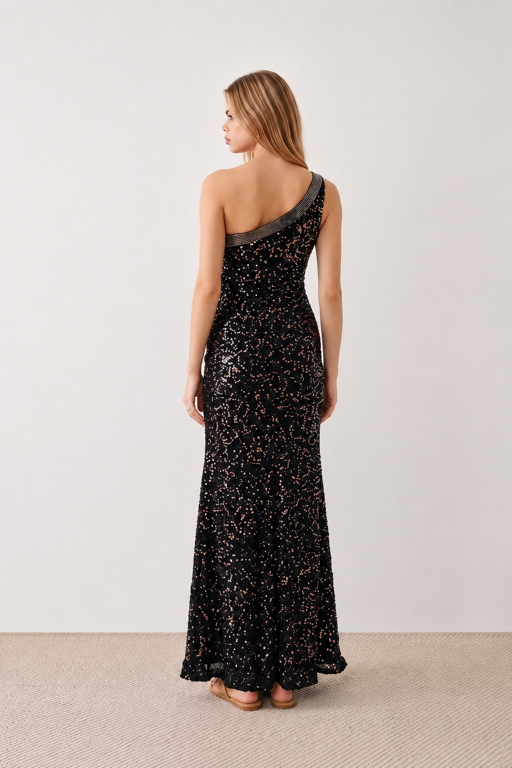 Women's Christa sequined asymmetric neck maxi dress with all-over shimmering sequins, elegant one-shoulder neckline, low open back, fitted silhouette and front thigh split, ideal for weddings, black-tie events, galas and formal evening occasions.