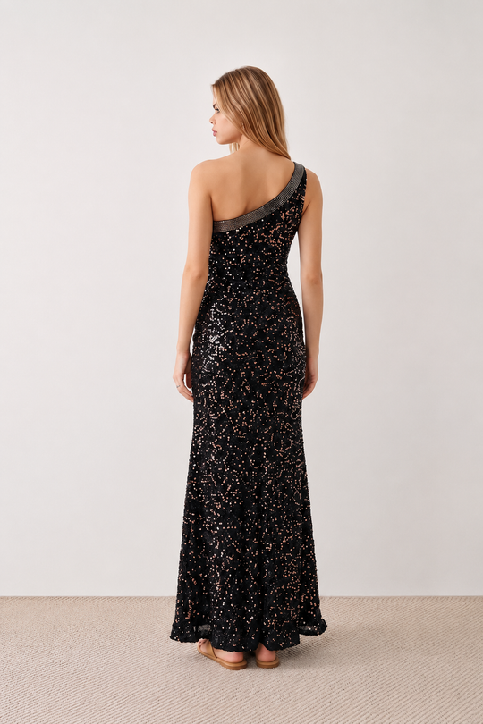 Women's Christa sequined asymmetric neck maxi dress with all-over shimmering sequins, elegant one-shoulder neckline, low open back, fitted silhouette and front thigh split, ideal for weddings, black-tie events, galas and formal evening occasions.