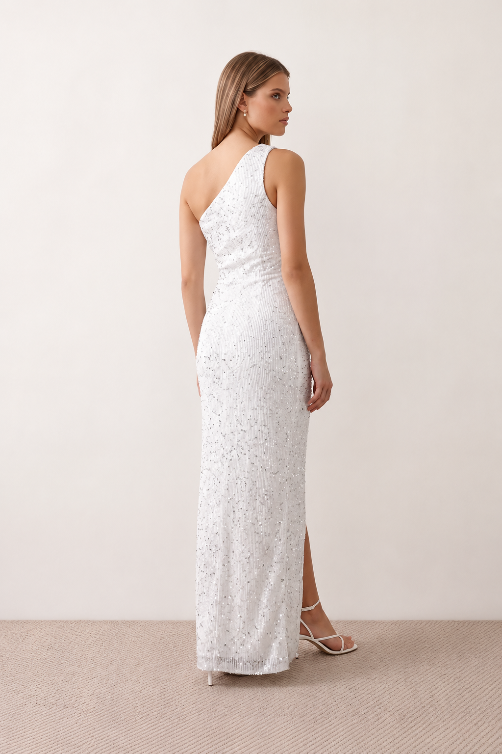 Women's Christa sequined asymmetric neck maxi dress with all-over shimmering sequins, elegant one-shoulder neckline, low open back, fitted silhouette and front thigh split, ideal for weddings, black-tie events, galas and formal evening occasions.