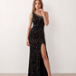 Women's Christa sequined asymmetric neck maxi dress with all-over shimmering sequins, elegant one-shoulder neckline, low open back, fitted silhouette and front thigh split, ideal for weddings, black-tie events, galas and formal evening occasions.