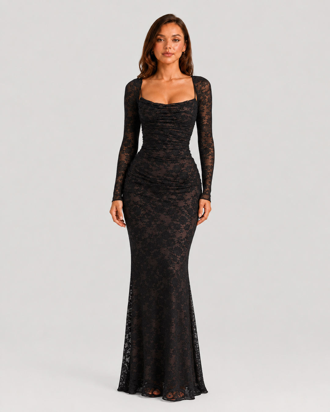 Woman wearing a lace corset maxi dress with a structured bodice, adjustable lace-up back, delicate lace detailing, and flowing floor-length silhouette.