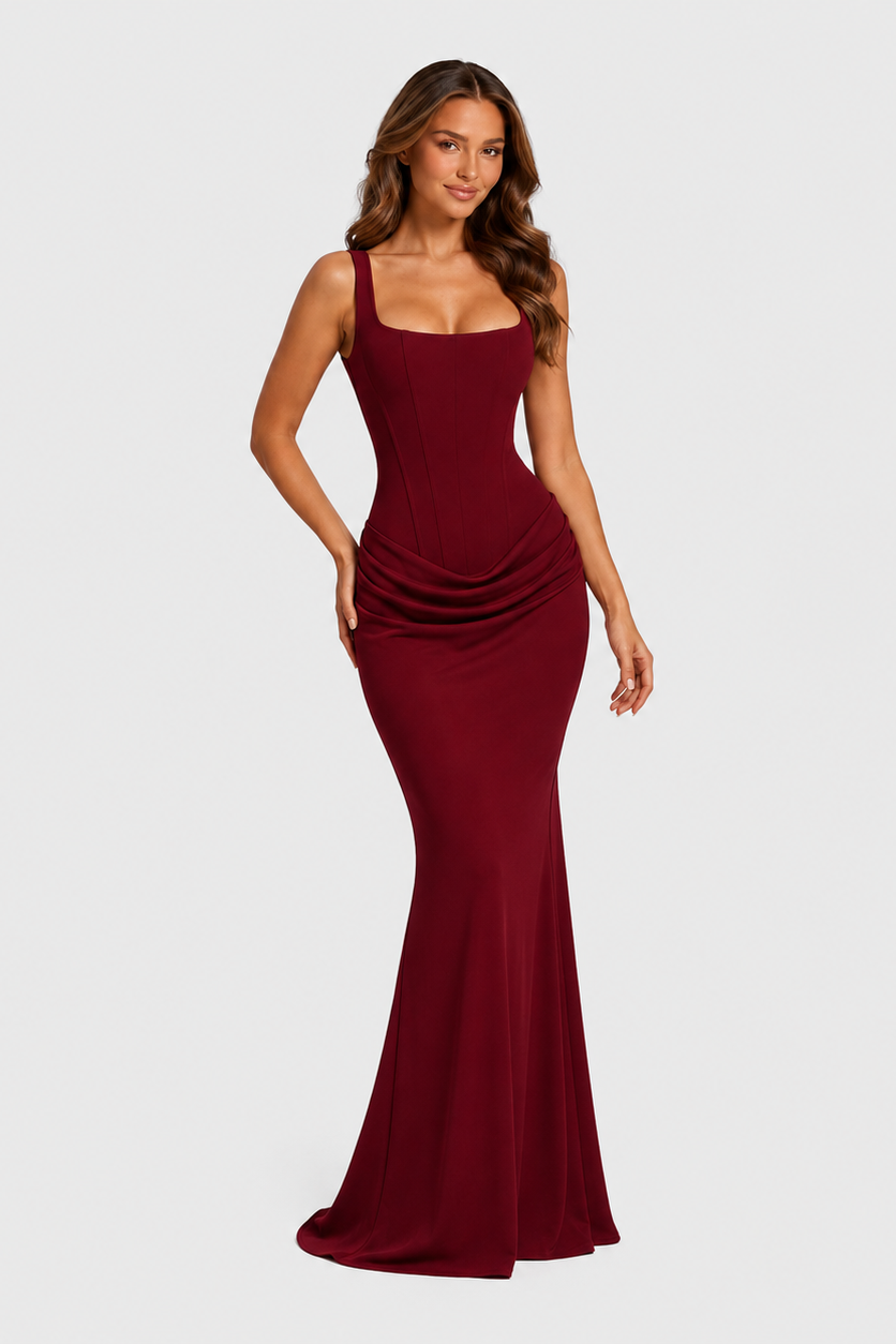 Women's elegant corset maxi dress featuring a structured bodice, dropped waist silhouette, and flowing pleated skirt for formal occasions.