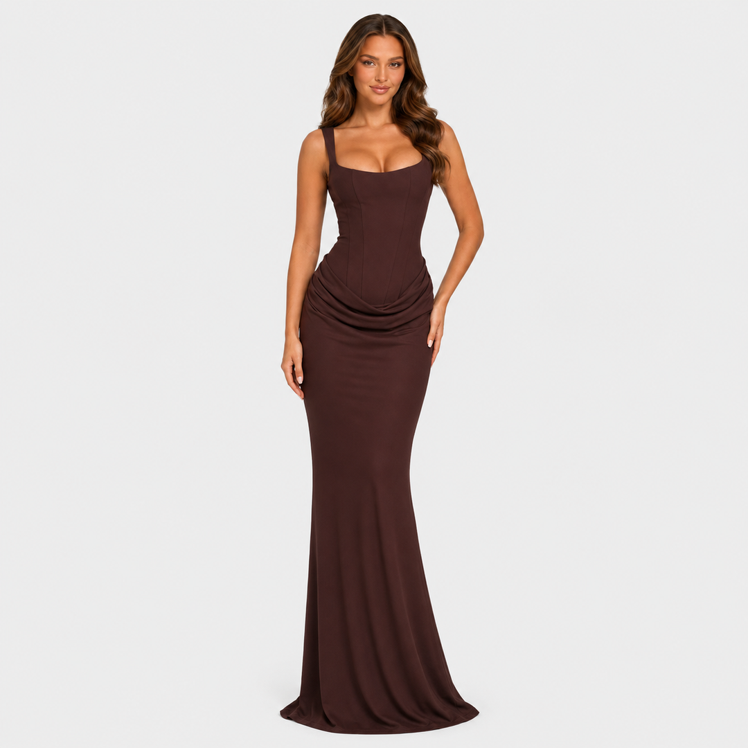 Women's elegant corset maxi dress featuring a structured bodice, dropped waist silhouette, and flowing pleated skirt for formal occasions.
