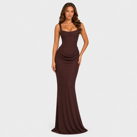 Women's elegant corset maxi dress featuring a structured bodice, dropped waist silhouette, and flowing pleated skirt for formal occasions.