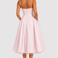 Women's satin-feel corset midi dress with sweetheart neckline, adjustable straps, fitted bodice, and full flowing skirt for weddings and special occasions.