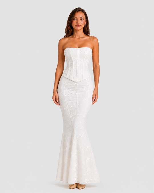 Women's floral embroidered corset gown with a fitted bodice, delicate embroidery, and softly flared hem in an elegant ivory-inspired design.