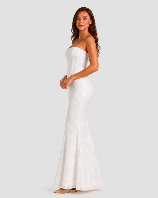 Women's floral embroidered corset gown with a fitted bodice, delicate embroidery, and softly flared hem in an elegant ivory-inspired design.