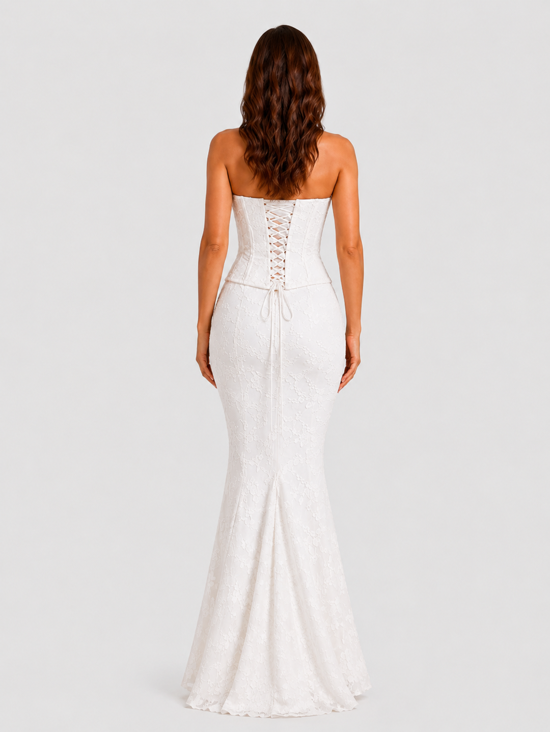 Women's floral embroidered corset gown with a fitted bodice, delicate embroidery, and softly flared hem in an elegant ivory-inspired design.