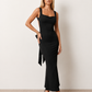 Woman wearing the Aline Cowl Neck Backless Maxi Dress in a floor-length fitted silhouette with a draped cowl neckline, elegant open back, oversized satin bow tie detail, sleeveless design, and smooth woven fabric, ideal for weddings, black-tie events, galas, and evening occasions.