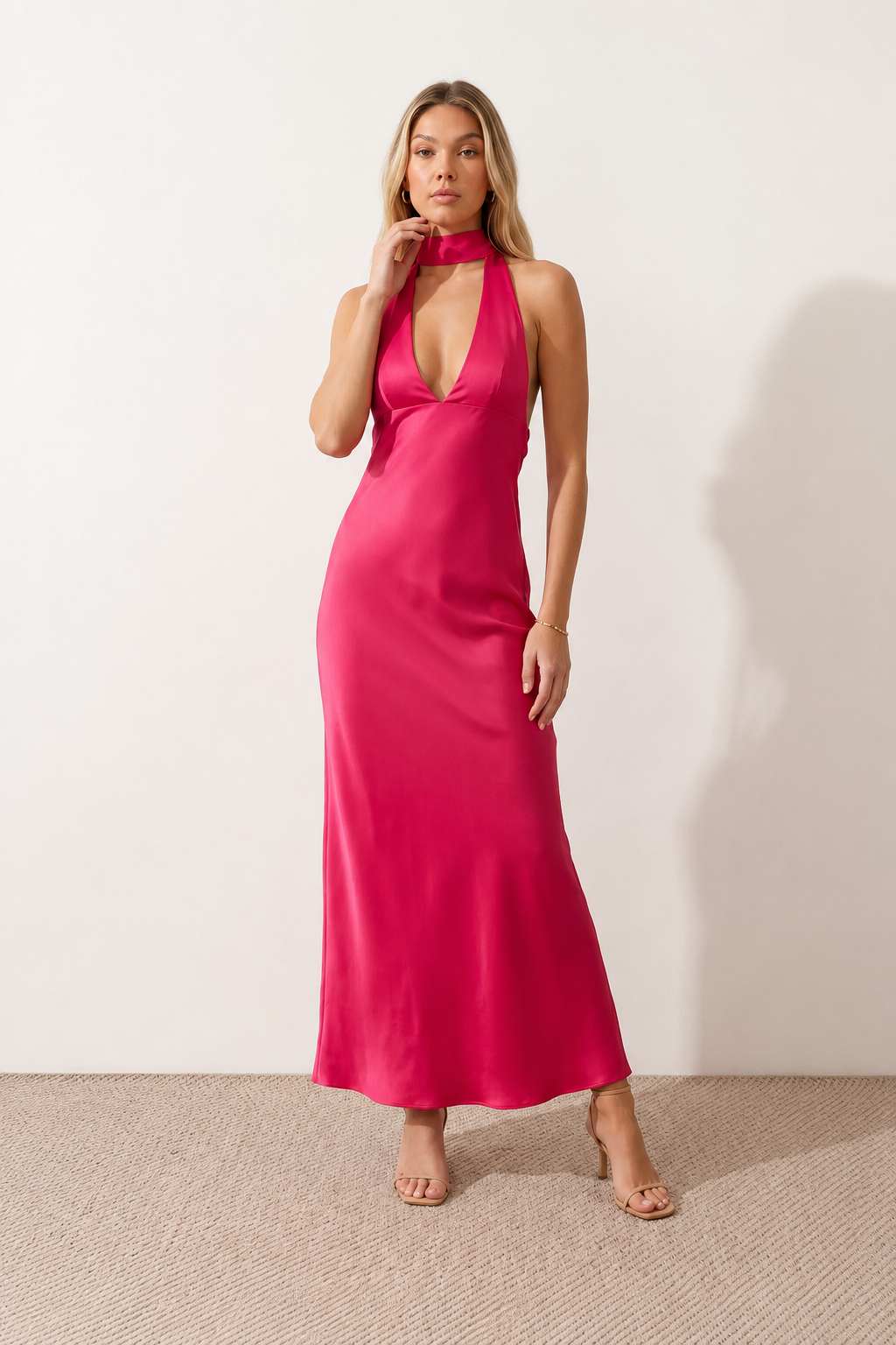 Aleena cowl neck halter maxi dress with a deep draped neckline, fitted halter strap, open back with tie-neck closure, sleeveless column silhouette, and floor-length straight hem in a smooth, elegant finish.
