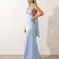 Aleena cowl neck halter maxi dress with a deep draped neckline, fitted halter strap, open back with tie-neck closure, sleeveless column silhouette, and floor-length straight hem in a smooth, elegant finish.