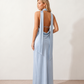 Aleena cowl neck halter maxi dress with a deep draped neckline, fitted halter strap, open back with tie-neck closure, sleeveless column silhouette, and floor-length straight hem in a smooth, elegant finish.