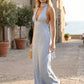 Aleena cowl neck halter maxi dress with a deep draped neckline, fitted halter strap, open back with tie-neck closure, sleeveless column silhouette, and floor-length straight hem in a smooth, elegant finish.