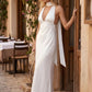 Aleena cowl neck halter maxi dress with a deep draped neckline, fitted halter strap, open back with tie-neck closure, sleeveless column silhouette, and floor-length straight hem in a smooth, elegant finish.