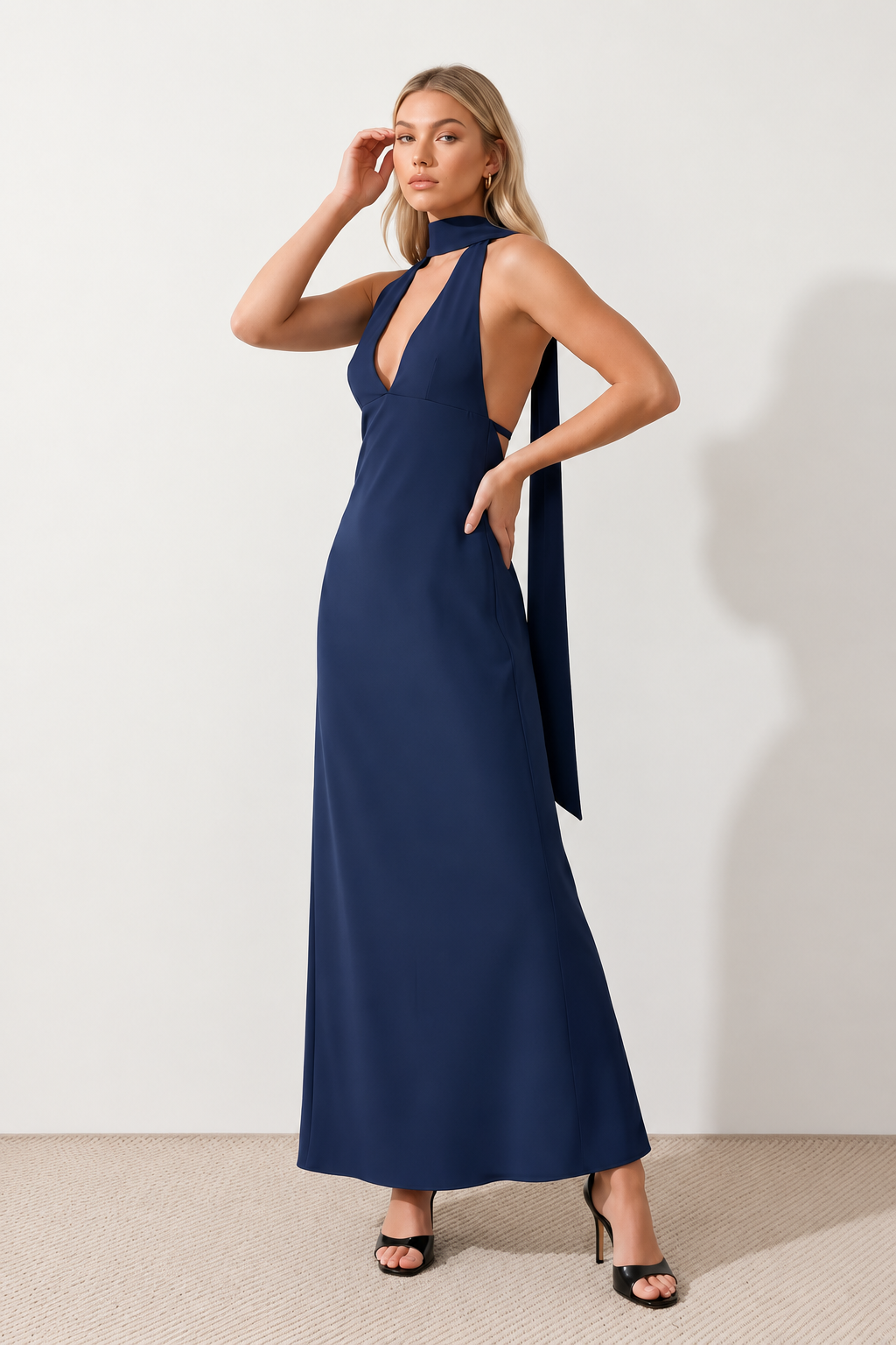 Aleena cowl neck halter maxi dress with a deep draped neckline, fitted halter strap, open back with tie-neck closure, sleeveless column silhouette, and floor-length straight hem in a smooth, elegant finish.