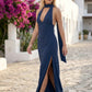 Aleena cowl neck halter maxi dress with a deep draped neckline, fitted halter strap, open back with tie-neck closure, sleeveless column silhouette, and floor-length straight hem in a smooth, elegant finish.