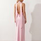 Aleena cowl neck halter maxi dress with a deep draped neckline, fitted halter strap, open back with tie-neck closure, sleeveless column silhouette, and floor-length straight hem in a smooth, elegant finish.