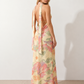Aleena cowl neck halter maxi dress with a deep draped neckline, fitted halter strap, open back with tie-neck closure, sleeveless column silhouette, and floor-length straight hem in a smooth, elegant finish.