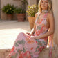 Aleena cowl neck halter maxi dress with a deep draped neckline, fitted halter strap, open back with tie-neck closure, sleeveless column silhouette, and floor-length straight hem in a smooth, elegant finish.