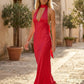 Aleena cowl neck halter maxi dress with a deep draped neckline, fitted halter strap, open back with tie-neck closure, sleeveless column silhouette, and floor-length straight hem in a smooth, elegant finish.