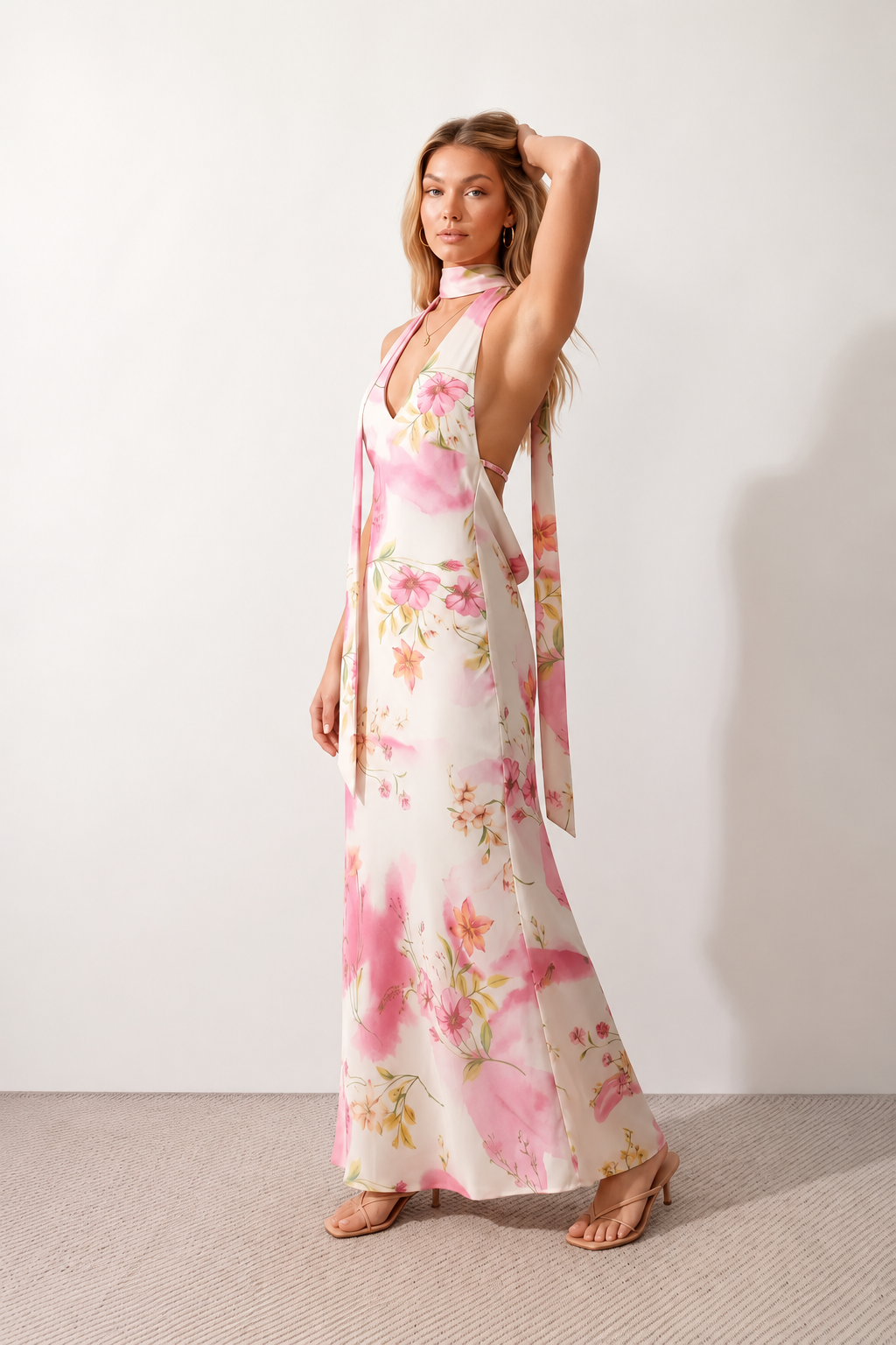 Aleena cowl neck halter maxi dress with a deep draped neckline, fitted halter strap, open back with tie-neck closure, sleeveless column silhouette, and floor-length straight hem in a smooth, elegant finish.