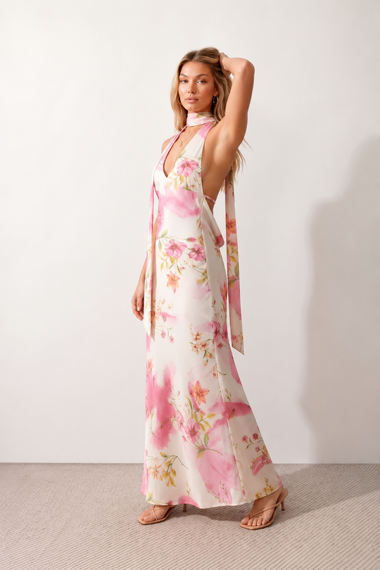 Aleena cowl neck halter maxi dress with a deep draped neckline, fitted halter strap, open back with tie-neck closure, sleeveless column silhouette, and floor-length straight hem in a smooth, elegant finish.