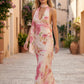 Aleena cowl neck halter maxi dress with a deep draped neckline, fitted halter strap, open back with tie-neck closure, sleeveless column silhouette, and floor-length straight hem in a smooth, elegant finish.