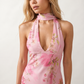 Aleena cowl neck halter maxi dress with a deep draped neckline, fitted halter strap, open back with tie-neck closure, sleeveless column silhouette, and floor-length straight hem in a smooth, elegant finish.