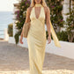 Aleena cowl neck halter maxi dress with a deep draped neckline, fitted halter strap, open back with tie-neck closure, sleeveless column silhouette, and floor-length straight hem in a smooth, elegant finish.