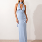 Aleena cowl neck halter maxi dress with a deep draped neckline, fitted halter strap, open back with tie-neck closure, sleeveless column silhouette, and floor-length straight hem in a smooth, elegant finish.