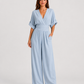 Women's deep V-neck wide-leg jumpsuit with cinched waist, relaxed rolled sleeves, lightweight flowing fabric and side pockets in an elegant silhouette.