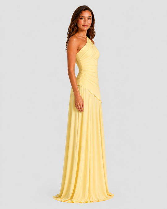 Woman wearing a one-shoulder chiffon maxi dress featuring a pleated neckline, corset bodice with lace-up back, and flowing godet skirt in an elegant formal silhouette.