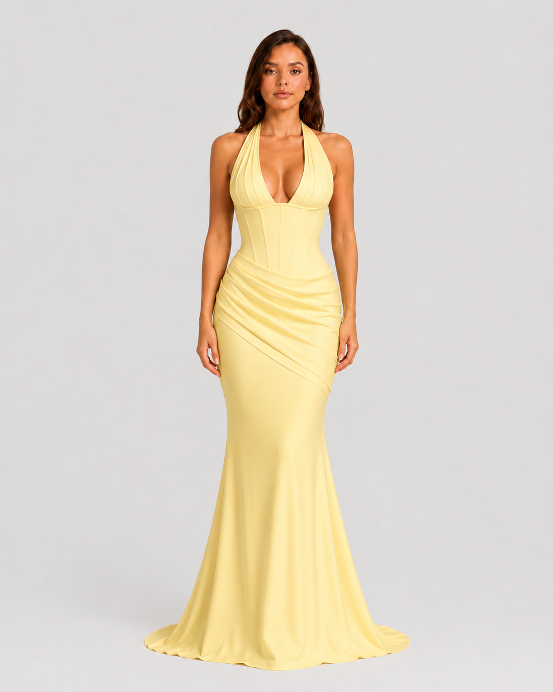 Women's halter corset evening gown featuring a plunge neckline, structured boned bodice, asymmetric pleated draped skirt detail, lace-up back, and softly flared crepe silhouette.