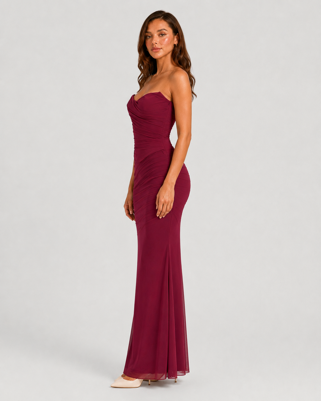 Women's draped mesh corset top with structured boning, sheer mesh fabric, fitted silhouette, and detachable scarf accessory for elegant evening styling.