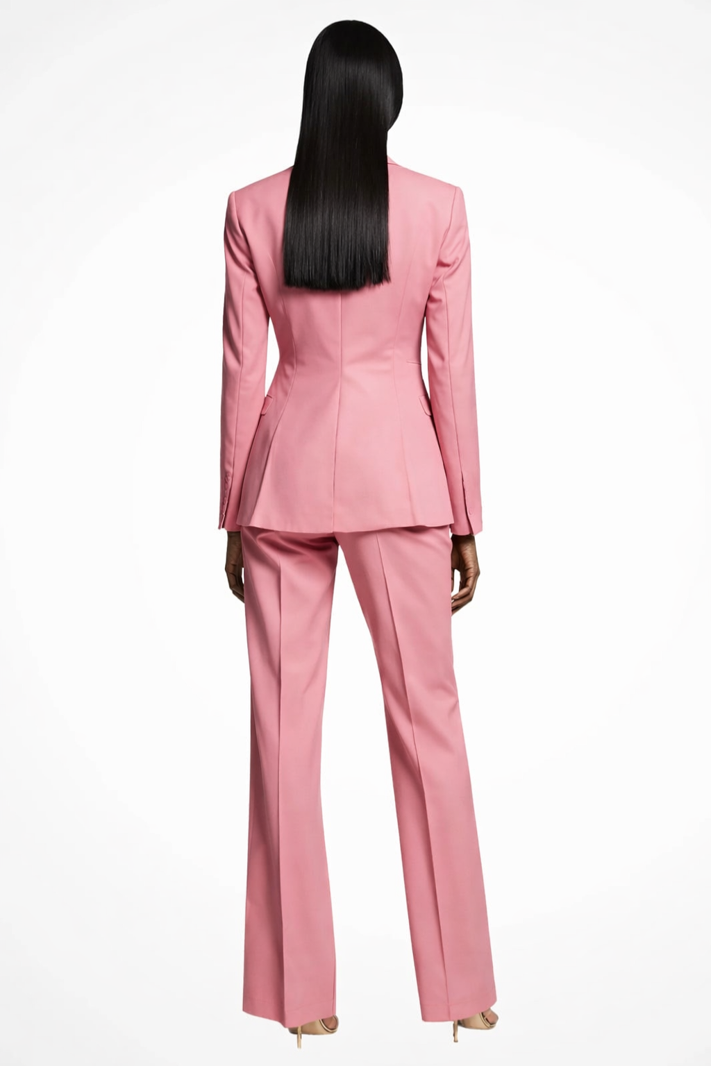 Person wearing a pink suit on a white background
