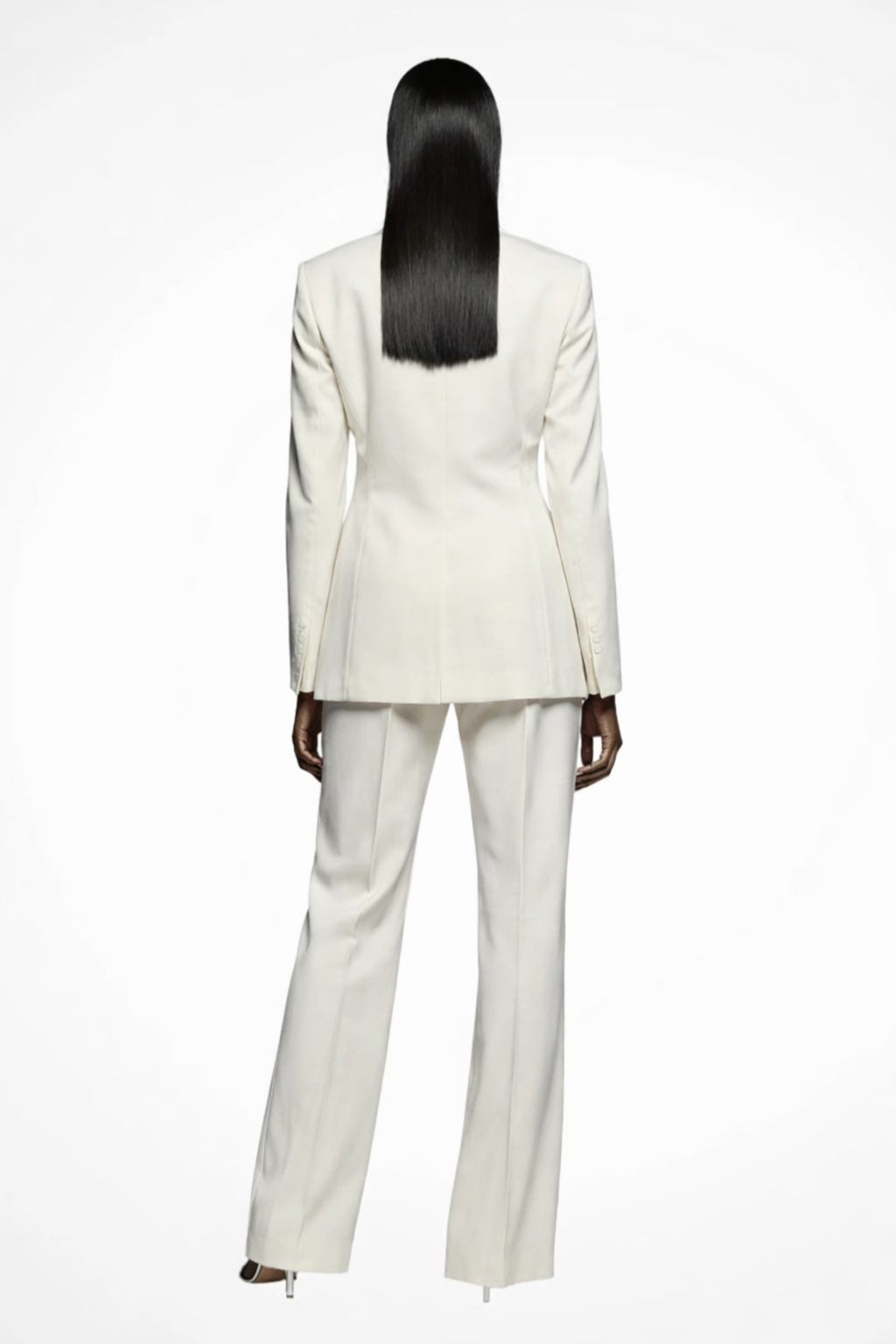 Person wearing a white suit on a white background
