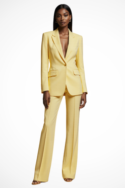 Woman wearing a yellow suit on a white background