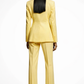 Person wearing a yellow suit on a white background