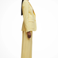 Woman wearing a yellow suit on a white background