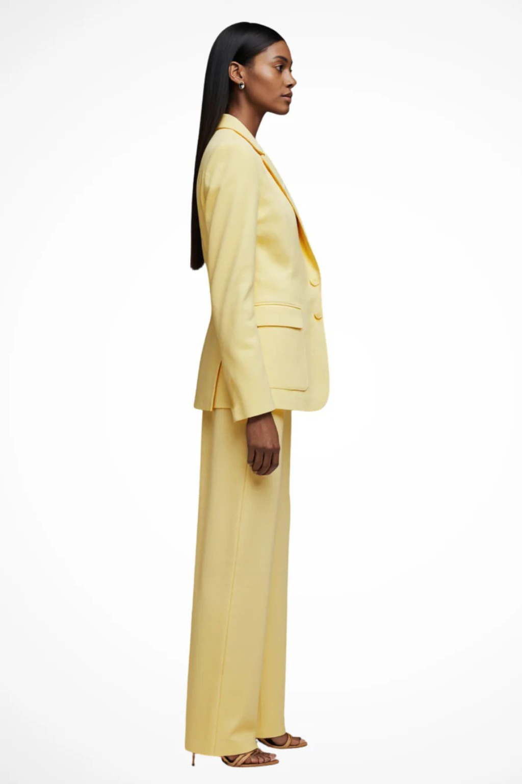 Woman wearing a yellow suit on a white background
