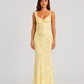 Woman wearing a floral maxi dress with delicate ruffle straps, slim-fit silhouette, flowing lightweight fabric, and romantic summer styling.