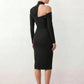 Woman wearing the Asymmetric Neck Open Back Midi Dress featuring an asymmetric mock-neck halter, off-shoulder ruched detailing, long fitted sleeves, an elegant open back, fitted midi silhouette and front slit, styled for weddings, cocktail parties and formal occasions.