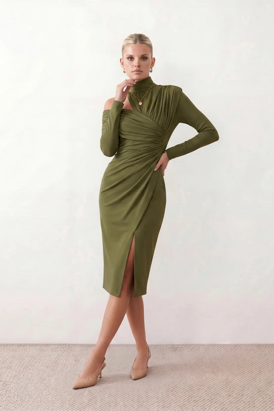 Woman wearing the Felisa Asymmetric Neck Open Back Midi Dress featuring an asymmetric mock-neck halter, off-shoulder ruched detailing, long fitted sleeves, an elegant open back, fitted midi silhouette and front slit, styled for weddings, cocktail parties and formal occasions.