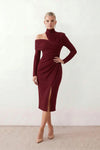 Woman wearing the Asymmetric Neck Open Back Midi Dress featuring an asymmetric mock-neck halter, off-shoulder ruched detailing, long fitted sleeves, an elegant open back, fitted midi silhouette and front slit, styled for weddings, cocktail parties and formal occasions.