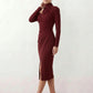 Woman wearing the Asymmetric Neck Open Back Midi Dress featuring an asymmetric mock-neck halter, off-shoulder ruched detailing, long fitted sleeves, an elegant open back, fitted midi silhouette and front slit, styled for weddings, cocktail parties and formal occasions.
