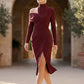 Woman wearing the Asymmetric Neck Open Back Midi Dress featuring an asymmetric mock-neck halter, off-shoulder ruched detailing, long fitted sleeves, an elegant open back, fitted midi silhouette and front slit, styled for weddings, cocktail parties and formal occasions.