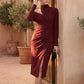 Woman wearing the Asymmetric Neck Open Back Midi Dress featuring an asymmetric mock-neck halter, off-shoulder ruched detailing, long fitted sleeves, an elegant open back, fitted midi silhouette and front slit, styled for weddings, cocktail parties and formal occasions.