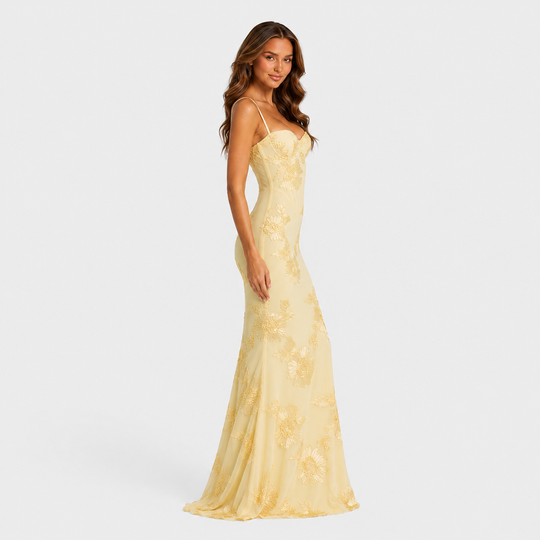 Women's floral embroidered corset maxi dress with delicate straps, fitted bodice, and flowing skirt for weddings and formal occasions.