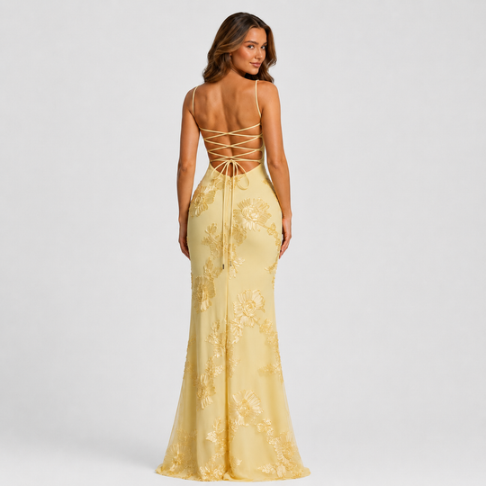 Women's floral embroidered corset maxi dress with delicate straps, fitted bodice, and flowing skirt for weddings and formal occasions.