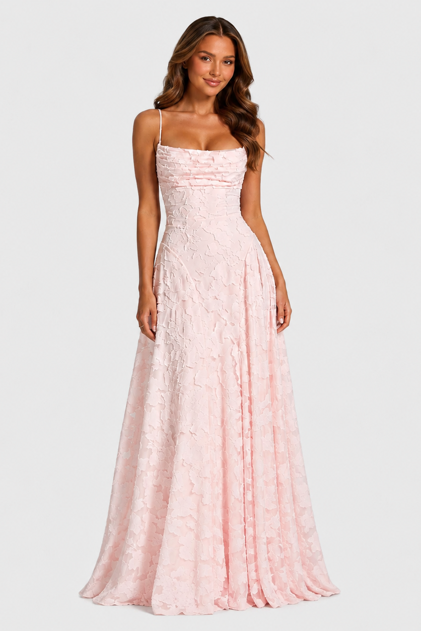 Women's textured floral maxi dress with fitted bodice, delicate shoulder straps, and flowing skirt for elegant wedding guest and formal occasion wear.